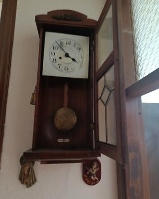 Orologio a pendolo da parete vintage