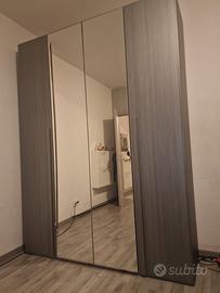 Set camera matrimoniale completo. Armadio 4 ante..