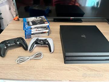 ps4 pro  con giochi due joystick e cavo lan