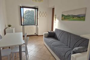 Bilocale con posto auto e parziale vista fiume