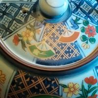 Teiera in porcellana con cinque ciotoline