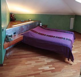 Mobile armadio ad angolo con letto matrimoniale
