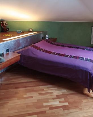 Mobile armadio ad angolo con letto matrimoniale