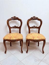 2 sedie in legno intagliato con tessuto floreale