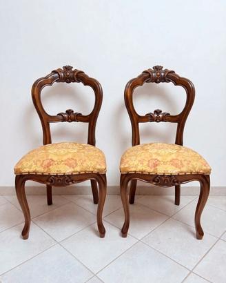 2 sedie in legno intagliato con tessuto floreale