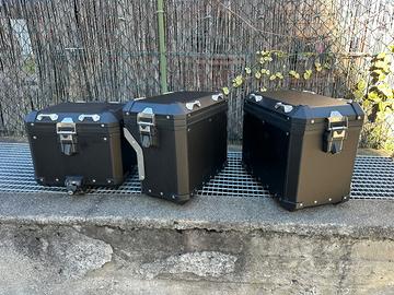 Tris Valigie Aluminio + estensioni + borse