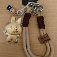 Portachiavi / laccio per telefono con personaggio 