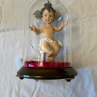 Statue religiose in campana di vetro