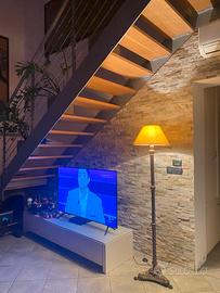 Lampada piantana in bronzo e ottone zampe leone