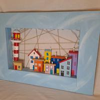 Borgo di mare con casette colorate e faro