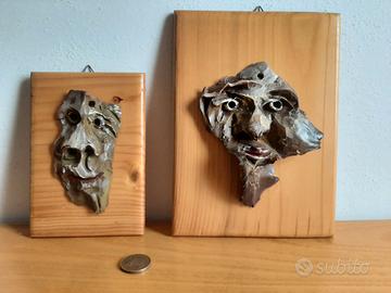 Sculture maschere ceramica su legno