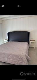 Letto matrimoniale con testiera alta