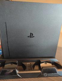PS 4 + videogiochi + 2  joystick + caricatore