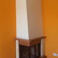 caminetto prefabbricato angolare