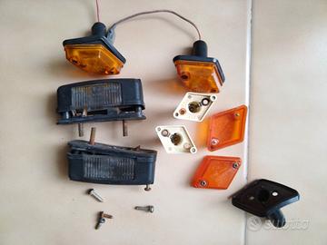 frecce romboidali + luci di retro e luci targa