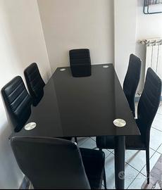 Tavolo in vetro con 6 sedie in simil pelle 