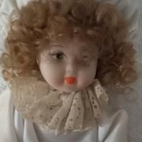 Bambola vintage con cuffia 25 cm
