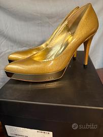 decoltè oro Gucci