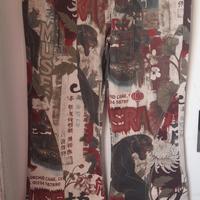 MUSERA Jeans a zampa con stampa e vita asimmetrica