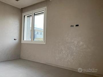 Serramenti in PVC con cassonetti a filo muro