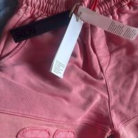 Pantaloncini corallo GCDS