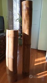 Candele giganti dentro il bambù.