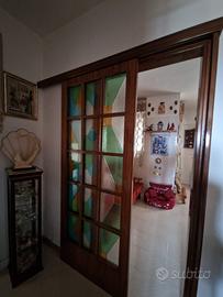 Porta con binario scorrevole