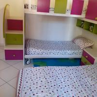 camera da letto con 3 letti