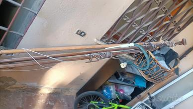 pali per tende in legno