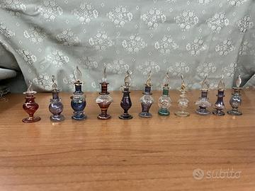 11 Flaconi di profumo in vetro soffiato