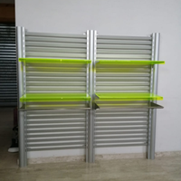 Scaffalatura/espositore in metallo satinato