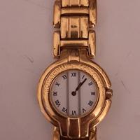 orologio metallo dorato