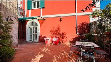Appartamento con giardino privato e 2 posti auto