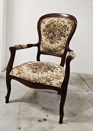 Poltrona vintage in legno con tappezzeria floreale
