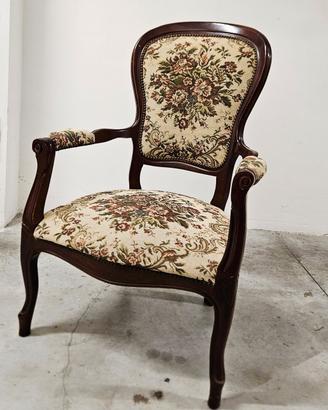 Poltrona vintage in legno con tappezzeria floreale