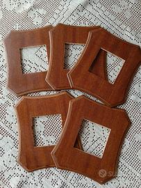 Cornici per interruttori elettrici in legno 