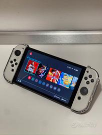 Nintendo Switch OLED + 4 giochi + 2 paia Joy-Con