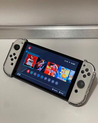 Nintendo Switch OLED + 4 giochi + 2 paia Joy-Con