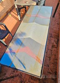 Tavolo da esterno con piano di cristallo