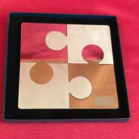 puzzle in acciaio di design