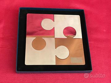 puzzle in acciaio di design