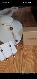 Collana lunga e orecchini in bronzo dorato e onice