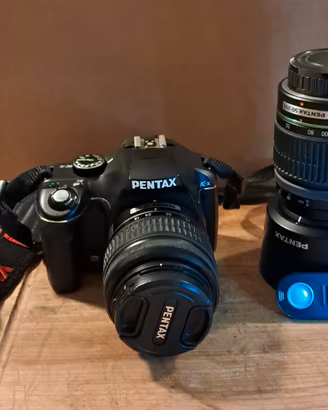 Pentax k-x con ob. 18-55mm e 50-200mm