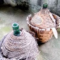 Damigiane in vetro verde con collo irregolare