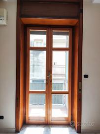 Porte in legno a due ante con Vetro Camera