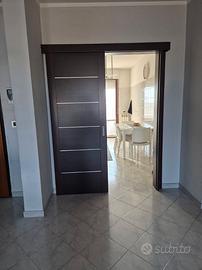 Porta scorrevole  esterno muro 82x210 + Binario