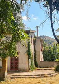 Casa nel verde con vista mare