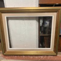 Cornice oro e verde d’acqua