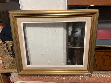 Cornice oro e verde d’acqua