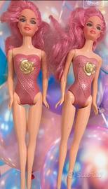 Lotto di bambole vestite e non